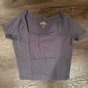 Medium Blue Hollister baby tee with lace trim